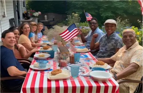 Group at picnic table celebrating the 4th of July