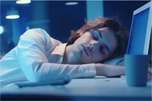 Man sleeping at desk - Workaholic Day